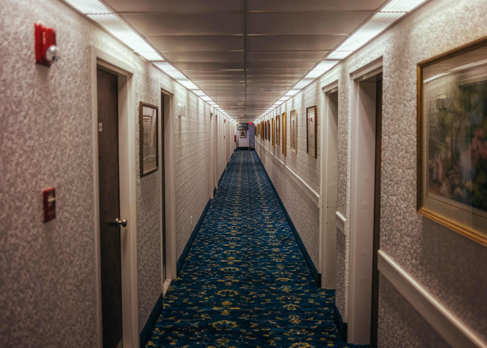 A brightly lit hotel hallway