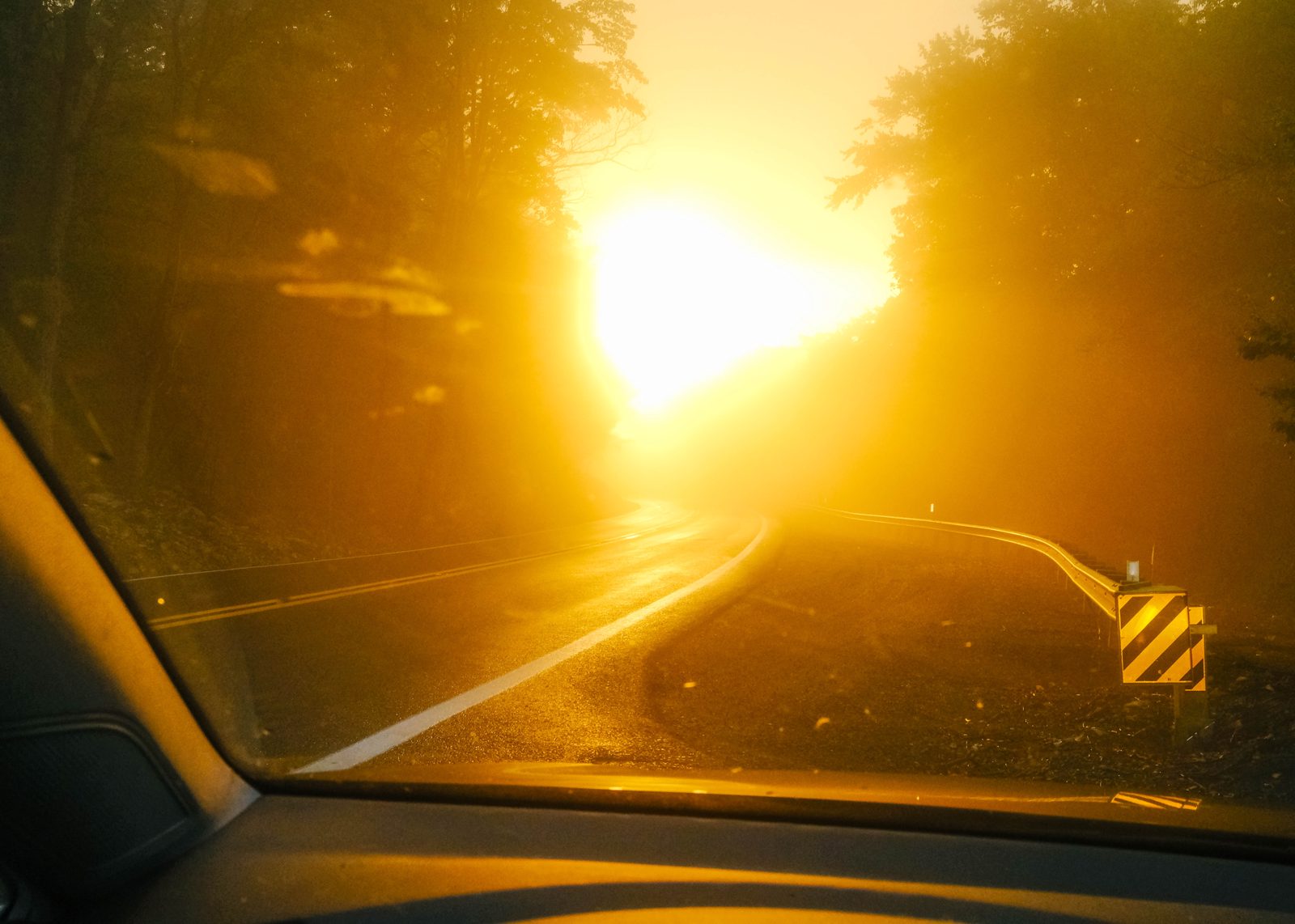 Bright yellow sunset from windshield