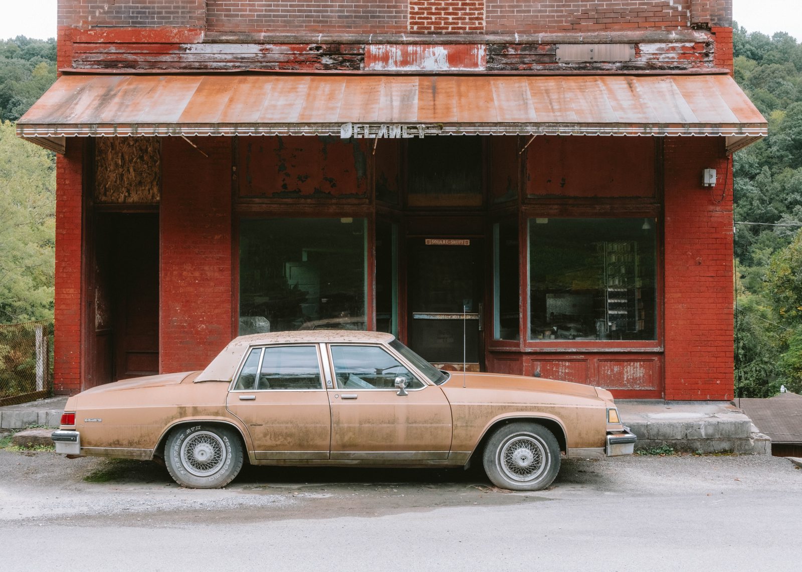 Abandoned shop with abandoned car